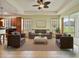Spacious living room with stylish furniture, ceiling fan, and plenty of natural light at 4469 Biscayne Breeze Way, Kissimmee, FL 34744
