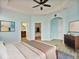 Spacious main bedroom with natural light, fan, walk-in closet, and ensuite bathroom at 4469 Biscayne Breeze Way, Kissimmee, FL 34744