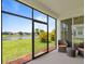 A screened patio offers views of a pond and landscaped greenery for outdoor enjoyment at 4469 Biscayne Breeze Way, Kissimmee, FL 34744