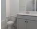 Bright bathroom with large mirror, white vanity, and tub at 4830 Prairie Preserve Run, St Cloud, FL 34772