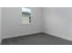 Neutral carpeted bedroom featuring a bright window at 4830 Prairie Preserve Run, St Cloud, FL 34772