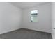 Clean bedroom featuring neutral carpet and bright window at 4830 Prairie Preserve Run, St Cloud, FL 34772