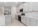 Modern kitchen with stainless steel appliances, stylish cabinets, and a convenient island for cooking at 4830 Prairie Preserve Run, St Cloud, FL 34772
