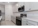 Well-appointed kitchen with stainless steel appliances, spacious counters, and plenty of cabinet storage at 4830 Prairie Preserve Run, St Cloud, FL 34772