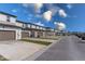 Row of townhomes with driveways and street parking at 4830 Prairie Preserve Run, St Cloud, FL 34772