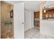 Bathroom leading into updated kitchen with stainless steel appliances at 522 Boxelder Ave, Altamonte Springs, FL 32714