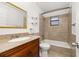 Bathroom features a vanity with granite countertop and bathtub with tile surround at 522 Boxelder Ave, Altamonte Springs, FL 32714