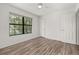 Bedroom featuring hardwood flooring, window, and closet at 522 Boxelder Ave, Altamonte Springs, FL 32714
