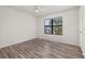 Bedroom with hardwood flooring, window, and ceiling fan at 522 Boxelder Ave, Altamonte Springs, FL 32714