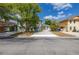 Charming two-story home with green siding, a concrete driveway, and mature trees in the front yard at 522 Boxelder Ave, Altamonte Springs, FL 32714