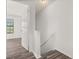 Hallway featuring hardwood floors and neutral paint color at 522 Boxelder Ave, Altamonte Springs, FL 32714