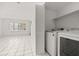 Bright laundry area featuring a full-size washer and dryer at 522 Boxelder Ave, Altamonte Springs, FL 32714