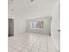 Spacious living room featuring tile floors, a bay window, and a staircase at 522 Boxelder Ave, Altamonte Springs, FL 32714