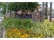 Community entrance sign for Oakland Village with stone pillars and colorful landscaping at 522 Boxelder Ave, Altamonte Springs, FL 32714