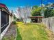 Spacious backyard featuring an outdoor storage structure, enhancing functionality and appeal at 5811 Harcourt Ave, Orlando, FL 32839