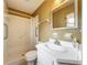 Bathroom featuring a walk-in shower with safety bars and a white vanity at 5811 Harcourt Ave, Orlando, FL 32839