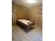 Simple bedroom features tiled floors, a twin bed, and a window with floral curtains at 5811 Harcourt Ave, Orlando, FL 32839