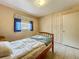 Well-lit bedroom with tile floors, a bright window, and a spacious closet at 5811 Harcourt Ave, Orlando, FL 32839