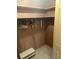 Walk-in closet with ample storage space, shelving, and tiled flooring at 5811 Harcourt Ave, Orlando, FL 32839