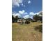 Charming single-story home with a lush lawn, mature trees, and welcoming curb appeal in a residential setting at 5811 Harcourt Ave, Orlando, FL 32839