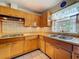 Bright kitchen with white tile backsplash, modern appliances, and butcher block countertops at 5811 Harcourt Ave, Orlando, FL 32839
