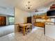 Well-lit kitchen featuring a dining nook and stainless steel appliances at 5811 Harcourt Ave, Orlando, FL 32839