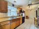 Traditional eat-in kitchen with stainless steel appliances and tile flooring at 5811 Harcourt Ave, Orlando, FL 32839