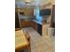 Functional kitchen with tile floors, wood cabinets, and modern appliances at 5811 Harcourt Ave, Orlando, FL 32839