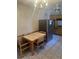 View of kitchen with dining table, tile floors, and stainless steel refrigerator at 5811 Harcourt Ave, Orlando, FL 32839
