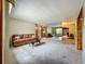 Bright living room with neutral carpet and a large mirror at 5811 Harcourt Ave, Orlando, FL 32839