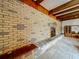 Living room showcasing an accent brick wall and built-in cabinets at 5811 Harcourt Ave, Orlando, FL 32839