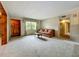 Inviting living room featuring a comfortable sofa and a window view at 5811 Harcourt Ave, Orlando, FL 32839