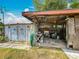 Outdoor storage featuring a workbench and double doors, providing space for projects and equipment at 5811 Harcourt Ave, Orlando, FL 32839