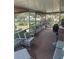 Comfortable screened-in patio with views of the landscaped backyard at 5811 Harcourt Ave, Orlando, FL 32839