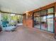 Relaxing sunroom with sliding glass doors, offering easy access to the outdoors and ample natural light at 5811 Harcourt Ave, Orlando, FL 32839