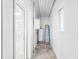 The unfinished basement offers a water heater, concrete walls, and access to the upstairs at 604 S Oxalis Ave, Orlando, FL 32807
