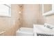 Updated bathroom features bathtub with a shower, a nice sink, and tile at 604 S Oxalis Ave, Orlando, FL 32807