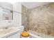 Bathroom featuring a walk-in shower with decorative tile at 604 S Oxalis Ave, Orlando, FL 32807
