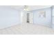 Spacious bedroom featuring tile floors and ample closet space at 604 S Oxalis Ave, Orlando, FL 32807