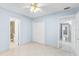 Bedroom with tile floors, neutral paint, and closet at 604 S Oxalis Ave, Orlando, FL 32807