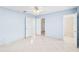 The primary bedroom has tile flooring, natural light, access to a bath, and a large closet at 604 S Oxalis Ave, Orlando, FL 32807