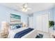 Bedroom with a queen bed and light blue walls at 604 S Oxalis Ave, Orlando, FL 32807