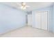 Bedroom with tile floors and closet at 604 S Oxalis Ave, Orlando, FL 32807