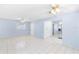 Living room features tile flooring and neutral paint colors at 604 S Oxalis Ave, Orlando, FL 32807