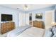 Bedroom with bed, wooden furniture, and closet at 604 S Oxalis Ave, Orlando, FL 32807