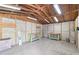 The block workshop is unfinished but offers work benches, high ceilings, and a concrete floor at 604 S Oxalis Ave, Orlando, FL 32807