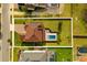 Aerial view of house and lot showing pool with patio in backyard, and driveway in front at 675 Primrose Willow Way, Apopka, FL 32712