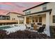 Outdoor patio featuring comfortable seating, outdoor ceiling fans, and a view of the backyard pool area at dusk at 675 Primrose Willow Way, Apopka, FL 32712