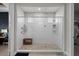 Modern bathroom featuring tiled shower with glass enclosure, bench, and dual shower heads at 675 Primrose Willow Way, Apopka, FL 32712