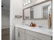 Bathroom featuring double sink vanity with modern fixtures and hardware at 675 Primrose Willow Way, Apopka, FL 32712